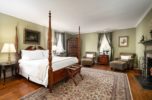 A gas fireplace and four post bed in our spacious Virginia bed and breakfast