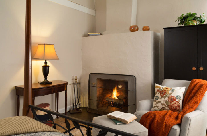 cozy gas fireplace and quaint sitting area