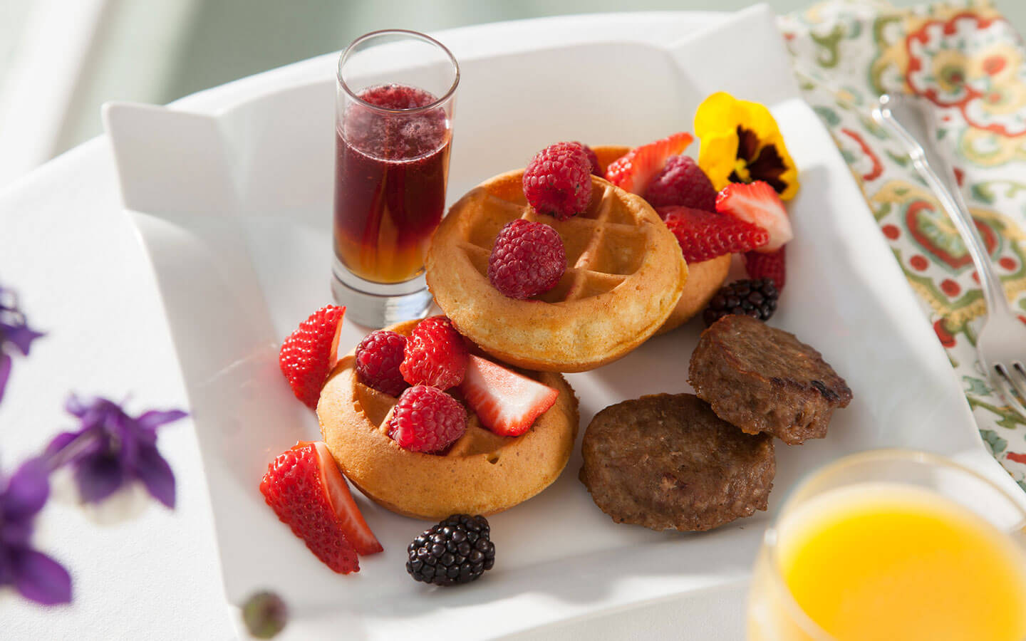 Waffles, sausage, and fresh fruit at our romantic Virginia bed and breakfast
